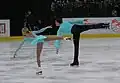 Side by side camel spins Tatiana Totmianina and Maxim Marinin