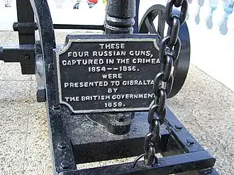 Plaque on Russian gun which reads: These four Russian guns, captured in the Crimea 1854--1856. were presented to Gibraltar by the British Government 1858.