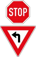 Stop. But drivers turning left must give way / yield
