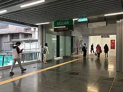 Commuters heading towards the pedestrian link to the One World Hotel