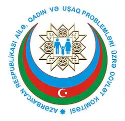 Committee logo, a man, woman and child inside a blue, red and green Islamic crescent