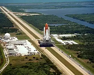 Space Shuttle Challenger atop an MLP atop a crawler, in transit to its launch pad prior to its final flight (STS-51-L), January 28, 1986