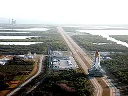 Atlantis with Destiny in its cargo bay heads to the launch pad