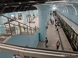 Mezzanine stairs looking down to Universiade-bound platform