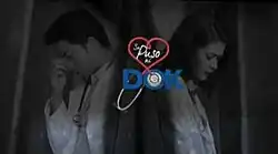 A monochrome image of Dennis Trillo and Bela Padilla, wearing a white coat, over a black background. The series title is displayed on the center of the image.