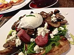 Sautéed field mushrooms on toast, with several additional ingredients