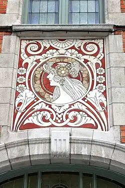 Art Nouveau sgraffito medallion on Rue Ernest Laude no. 20, Brussels, by Joseph Diongre and Privat Livemont, 1908[16]