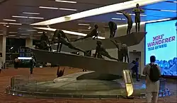 figures posed on a coil