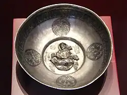 Lute player. Samanid (or Seljuk)[72] metal work, Khorezm, 10th century. Islamic Art Museum (Museum für Islamische Kunst), Berlin.[73]