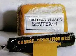 Two blocks of Semtex-1H (note the characteristic orange color) and an American M112 charge containing C4