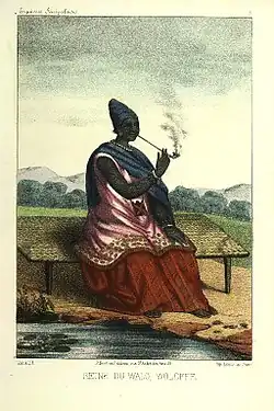 Image 9The Queen of Waalo - Lingeer Ndaté Yalla Mbodj (1810–1860) in her royal dress, seating and smoking a pipe. Credit: Llanta. Lithographer, Abbot P. David Boilat, author of text in his book Esquisses sénégalaises (1853). Source: cote : Gallica, bnf.fr - Réserve DT 549.2 B 67 M Atlas - planche n °5 - Notice n° : FRBNF38495418 - (Illustrations de Esquisses sénégalaises). Uploader to Wiki Commons Patricia.fidi More about Ndaté Yalla Mbodj...