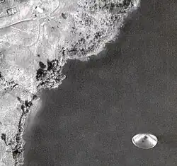 black and white photograph with reflective circular shape