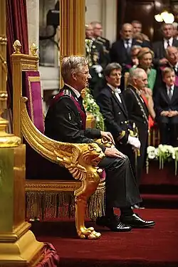 King Philippe I of Belgium seated on the throne inside the Palace of the Nation during his swearing-in ceremony
