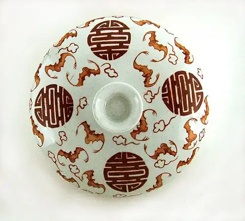 Ceramic with symbol and red bats