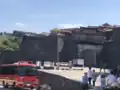 Shuri Castle's main gate and main hall's charred roof two days after the 2019 fire
