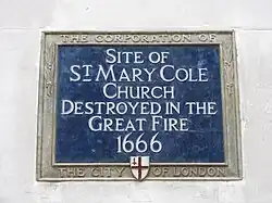 Blue historic plaque on site of St. Mary Cole Church which burnt down in Great Fire of 1666