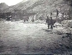 Boat attempting to navigate the river in 1897, photograph by Frank La Roche