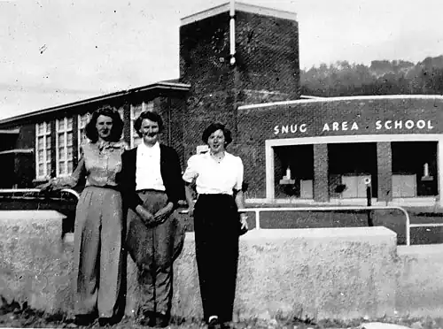 Three women outside Snug Area School, c. 1955. From the collection of Betty McDowell (née Thwaites), Museums Victoria.