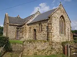 Stone building with tiled roof.