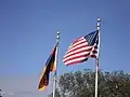 The Armenian and American flags in front of the church