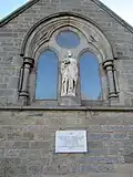 Statue and plaque