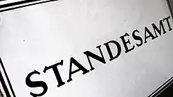 An enamel sign representing a Standesamt in 1950