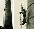 Laddering a chimney in central Bristol, England, taken around 1960. The enlargement shows the few safety precautions.