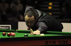 Stephen Maguire playing a shot