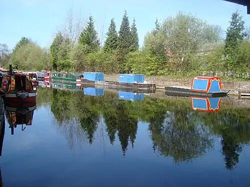The Stourbridge Canal Basin, a large canal with Barges sitting upon it.