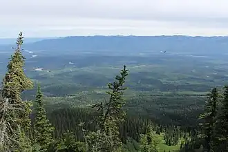 A view overlooking a large river valley and a highway