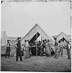 Photograph of a sutler's tent with clients
