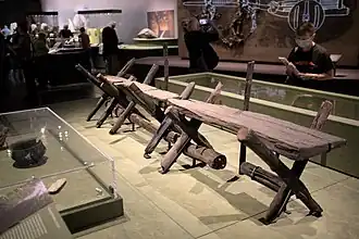 Vague straight track through boggy brush-covered ground