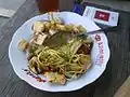 Kupat tahu, tofu served with rice cake, noodles and sweet soy sauce