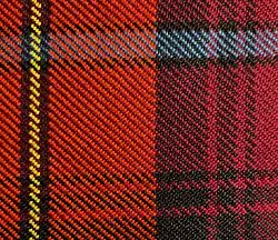 Close-up view of scarlet red, black, yellow, azure bleu, and crimson red tartan cloth