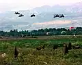 UH-60 Blackhawk and AH-64A Apache landing on 25 April 1999.