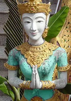Statue with namaste pose (wai) in a Thai temple