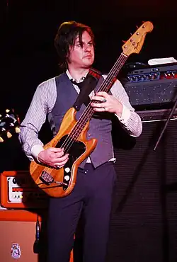 Hill performing with New York Dolls in 2011