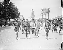 Official visit to the Western Front, with The Leaning Virgin in the background, 1917