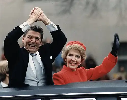 President-elect Ronald Reagan and his wife, Nancy, wave to the crowd during the Inaugural Parade (1981).