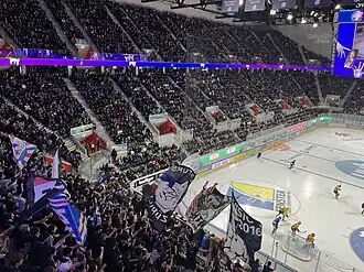Sold-out, double-decker back straight during a game between the ZSC Lions and SC Bern (2022)