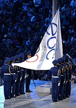 Members of the Azerbaijani National Guard raising the Olympic Flag.