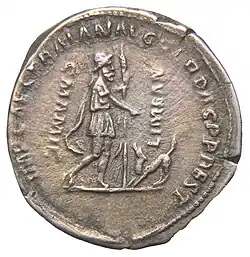 Silver coin: Odysseus, at left, wears a traveller's hat and cloak and carries a staff; Argus greets him with his head raised and tail wagging. An inscription naming the emperor Trajan is faintly visible.