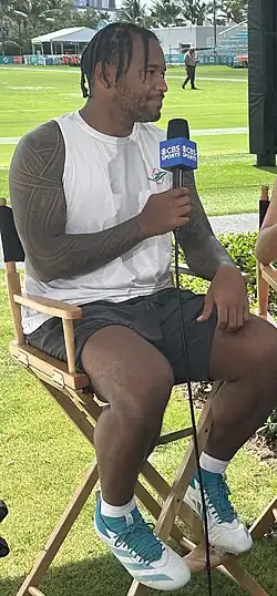 Tua Tagovailoa being interviewed by CBS Sports at Miami Dolphins training camp in July 2025