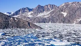 Tuttilik: The steep rock promontory where the fjord divides is where Watkin's memorial is sited.