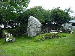 House built with standing stone as wall
