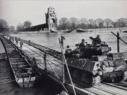 United States Army troops and an M-36 Tank Destroyer cross the Rhine on a heavy pontoon bridge during Operation Plunder, March 1945[1]