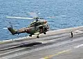 A French Army Light Aviation SA 330 Puma lands on USS George Washington