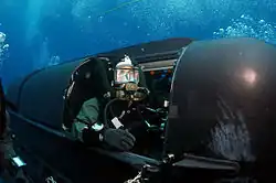 A member of SEAL Delivery Vehicle Team Two (SDVT-2) prepares to launch a Mark 8 SDV from Los Angeles-class attack submarine USS Philadelphia