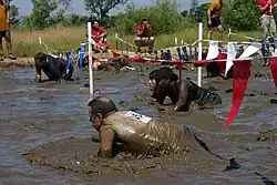A mud pit where participants have to crawl