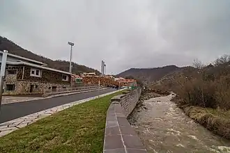 The campus is situated along a flowing river